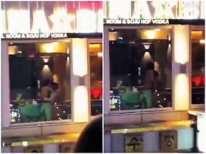 今年南韓1對男女在包廂親熱,但透明窗戶緊鄰街區,遭路過民眾圍觀偷拍。(翻攝微博)