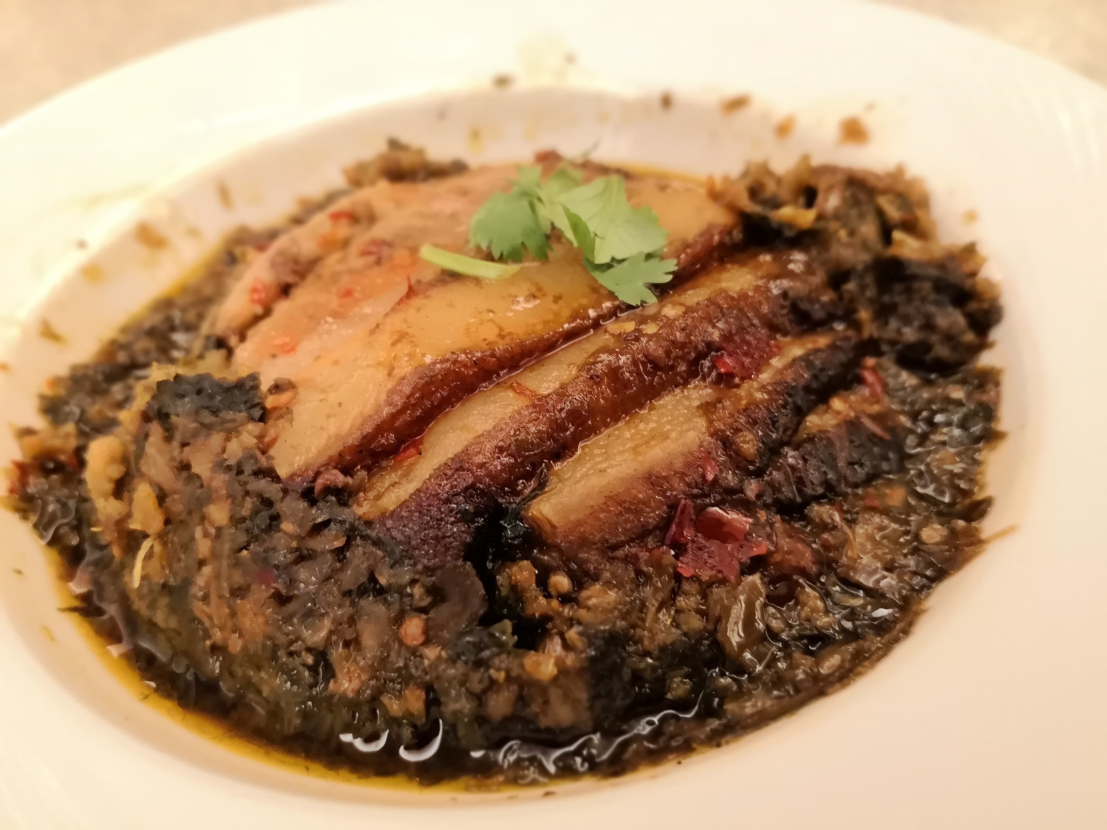 「福菜扣肉」是錦水的招牌料理。