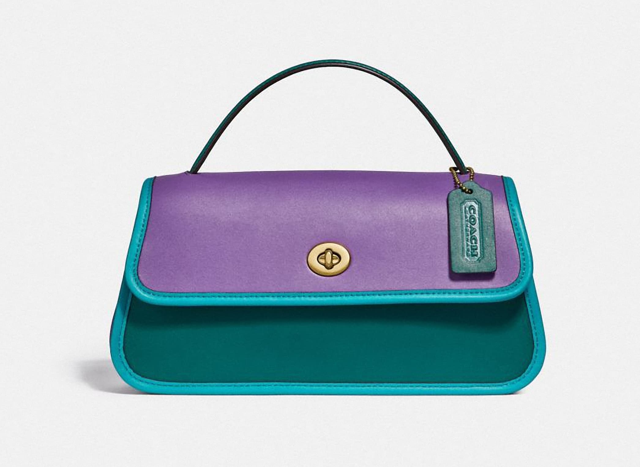 Originals Colorblock Binding Turnlock手拿包，NT$19,800。（COACH提供）