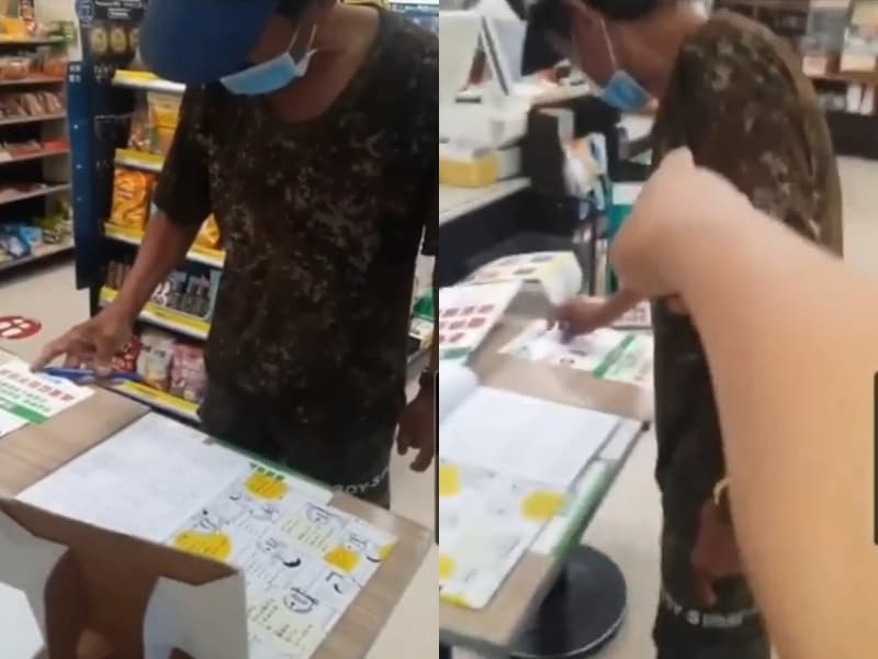 路人男不斷在迷彩男在補登實聯制資料時,逼對方「鞠躬道歉」否則要報警。(翻攝自「爆怨2公社」)
