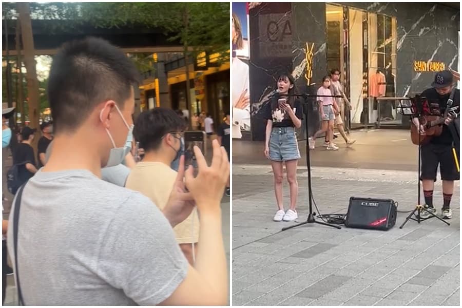 直播主「蛋捲」日前在信義區獻唱,吸引圍觀路人拍照錄影。(翻攝自臉書「爆廢公社二館」)