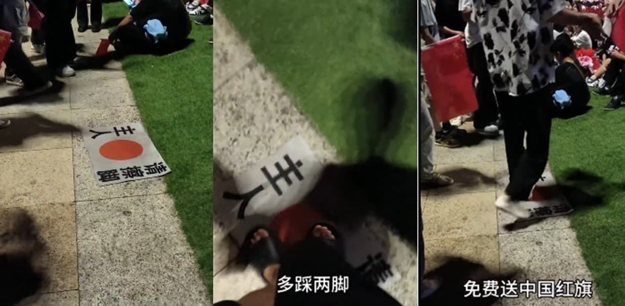 廣西南寧的仇日活動,現場有人鼓勵現場民眾踩日本國旗以免費換取五星旗。(翻攝微博)