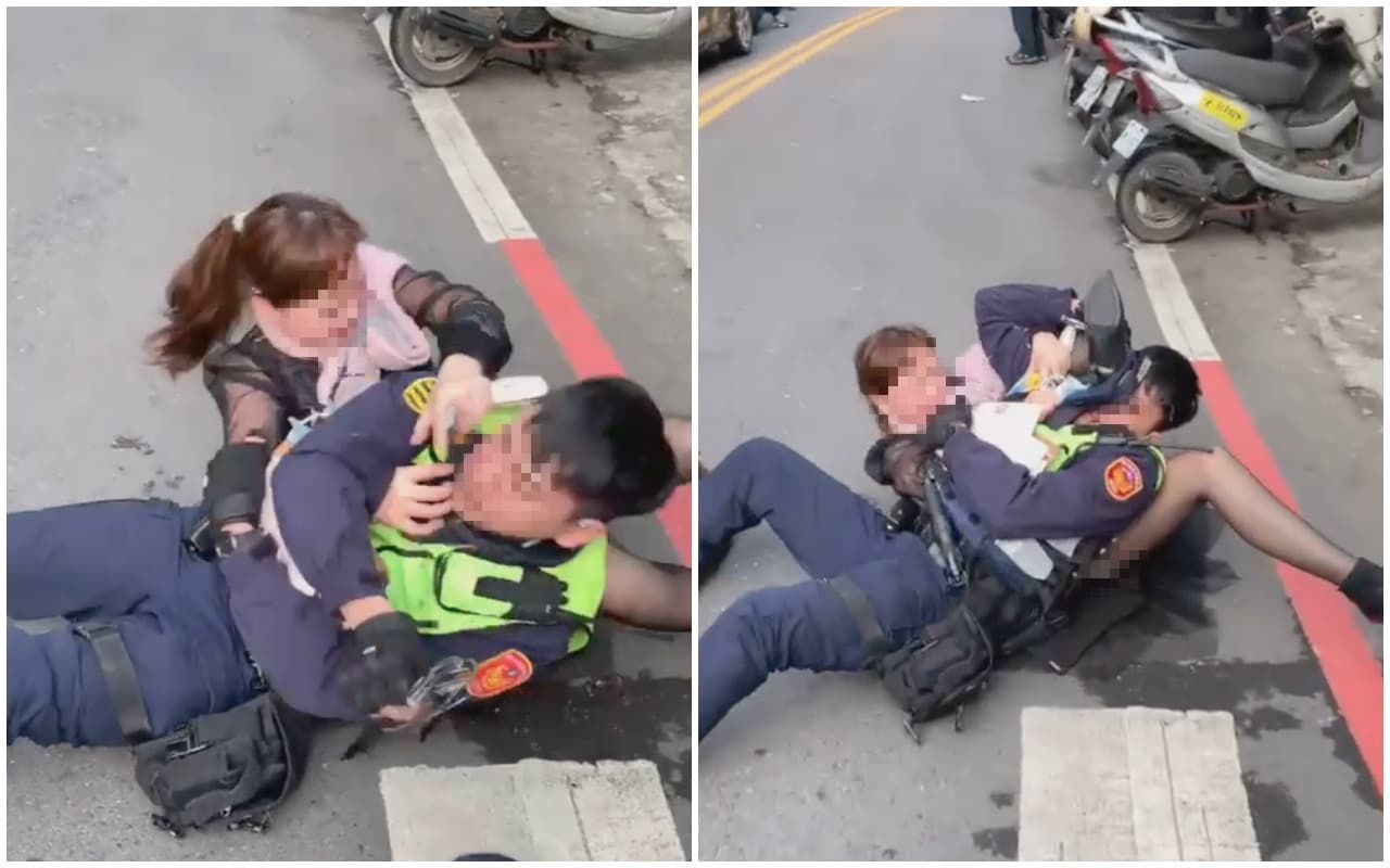 婦人不甘BMW遭拖吊,與警方產生爭執。(翻攝自「爆料公社」)