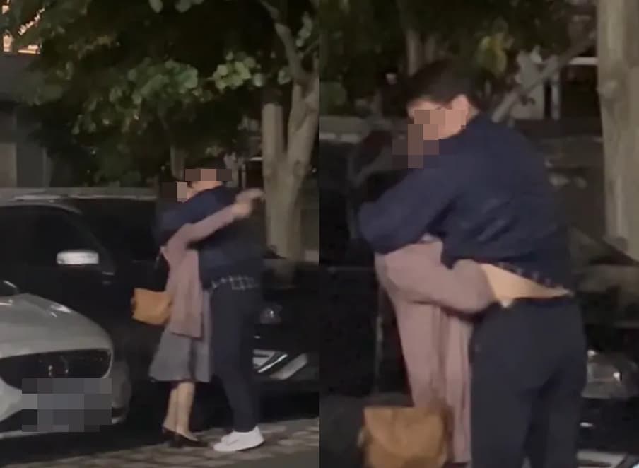 科技大廠處長與女同事當街擁吻,女方還伸手進對方衣服愛撫。(翻攝Dcard)